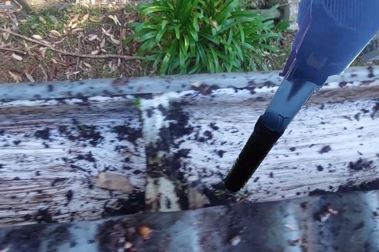 
ulladulla gutter cleaner achieves precision by using a blower to remove small debris from guttering.